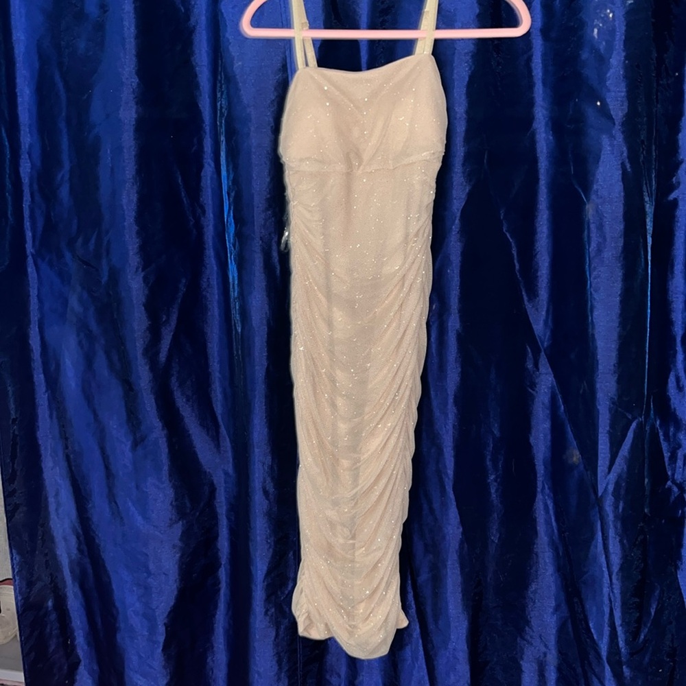 Sparkly cream color dress.